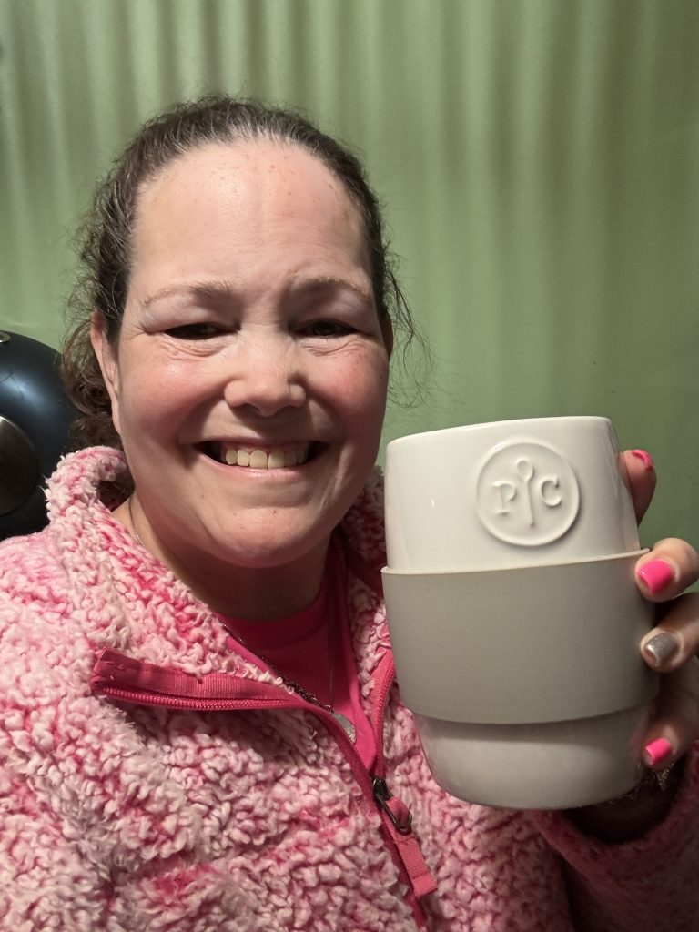 Michelle holding her Pampered Chef Ceramic Egg Cooker